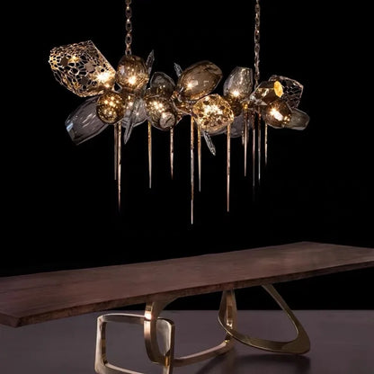 Vintage metal glass chandelier with glass shades on a plated chain mount