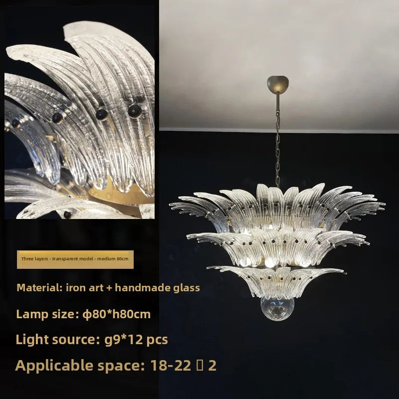 Plated metal chandelier frame carrying multiple tinted glass shades